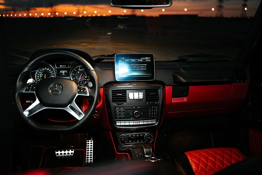 Luxury car interior detailing at night